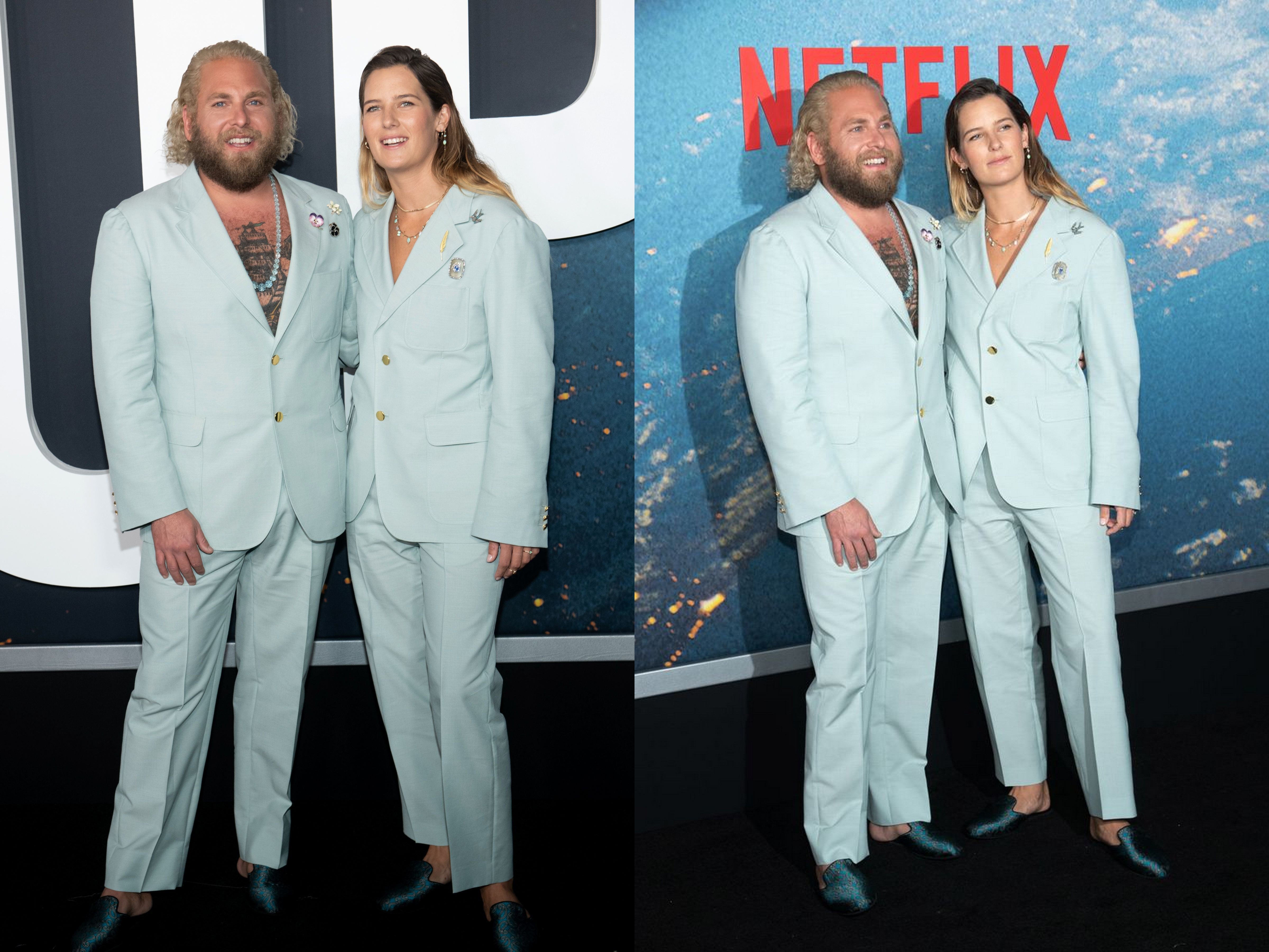 Jonah Hill pictured with his girlfriend Sarah Brady as they pose during a premiere wearing matching blue Gucci suits.
