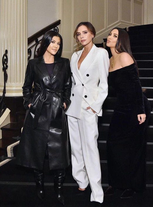 Photographed at a beauty dinner event, both Kourtney and Kim Kardashian are pictured with Victoria Beckham.