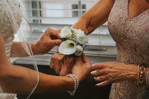 mother and bride, white flowers, hands, jewellery, dresses 