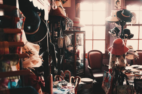 an photograph of the window of a hat shop