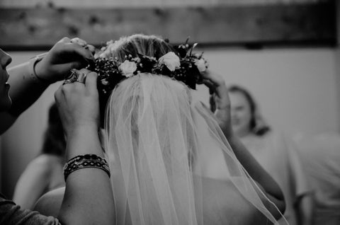 woman helping with brides headdress