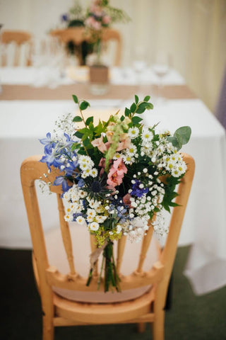 chair with flowers on the back of it 