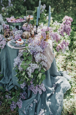 flowers on a table set for a wedding 