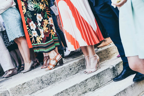 people standing on steps outside a church 