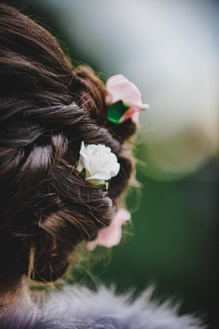 flowers in brown hair