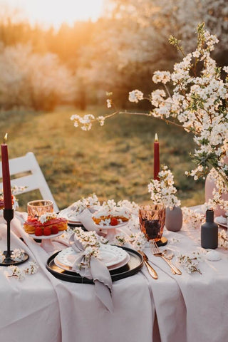 wedding table laid with flower in goldern hour 