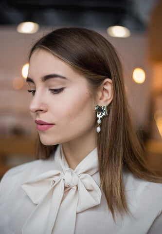 woman wearing earrings 