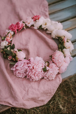 pink flowers on top of pink fabric 