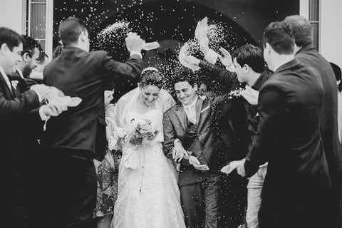 bride and groom, confetti, groomsmen black and white photograph