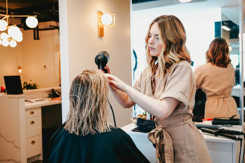 woman getting her hair done at hairdressers