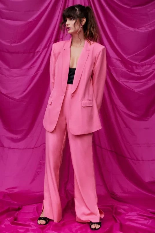 Pictured is a pink detailed suit blazer from Nasty Gal.