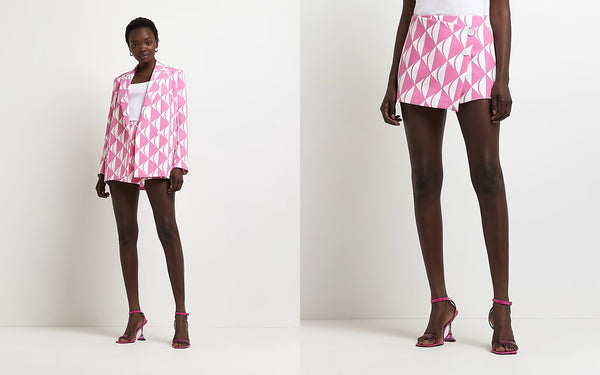 two website images showing the model wearing the pink print blazer and skort.