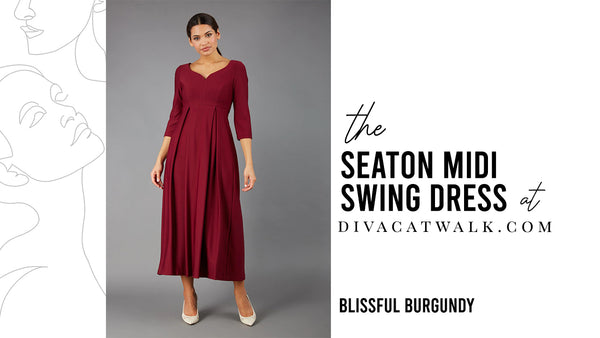  a woman model pictured wearing the Seaton Midi dress in Blissful Burgundy with text showing the dress title.