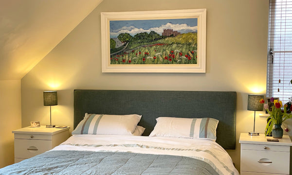 Painting above a bed