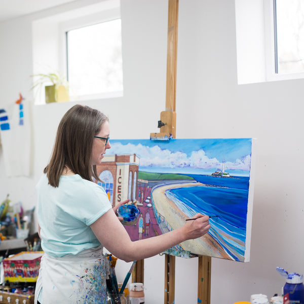 Artist Joanne Wishart Painting at her easel