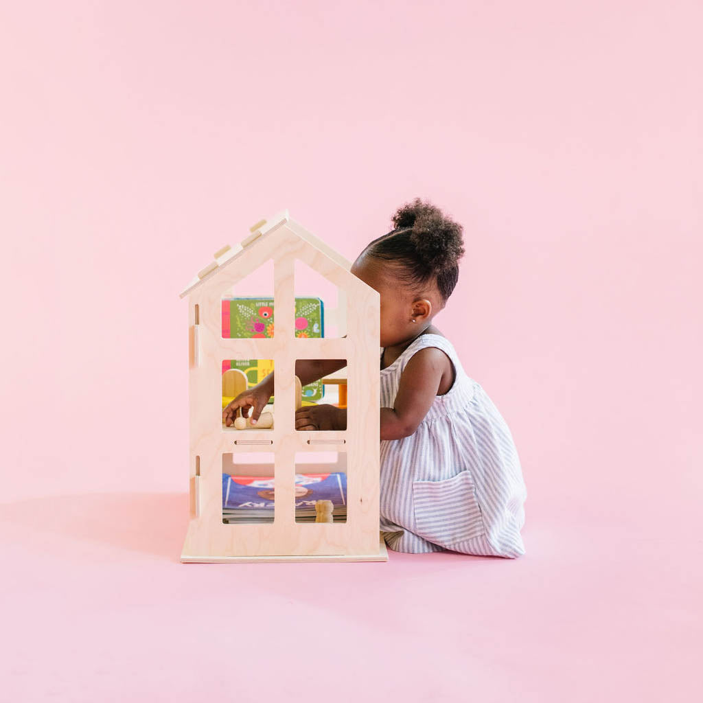 baby in the doll house