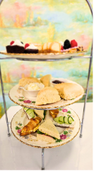 afternoon tea tray with finger sandwiches, scones, clotted cream & jam, cheesecakes, desserts and more