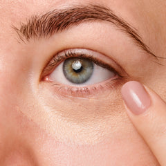 Woman Applying Under Eye Concealer 