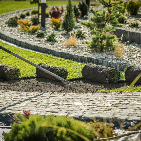 Landscape edging being installed on a pathway.