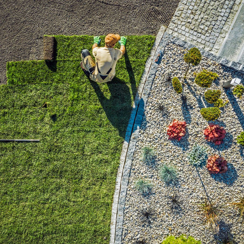 Landscaper using Bender Board for edging.