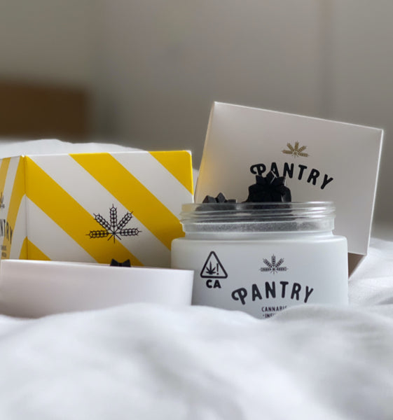 pantry nite bites and packaging on a fluffy white bed sheet