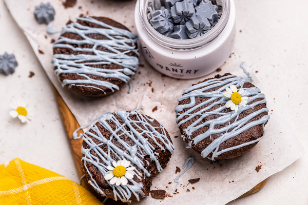 Blue Chocolate drizzle from Pantry Glow bites over three brownies