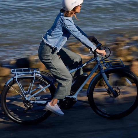 woman riding an ebike. 7 E-Bike Tips and Tricks