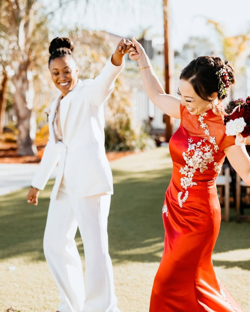 LGBTQ couple wearing traditional Chinese wedding dress