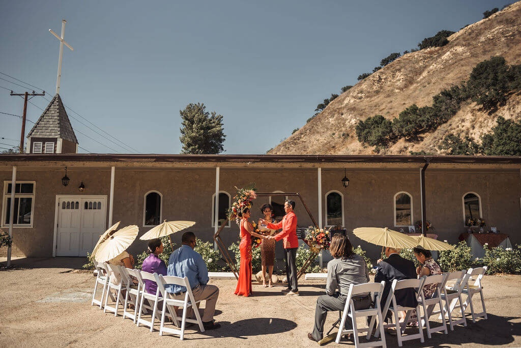 Intimate Asian American wedding outdoors