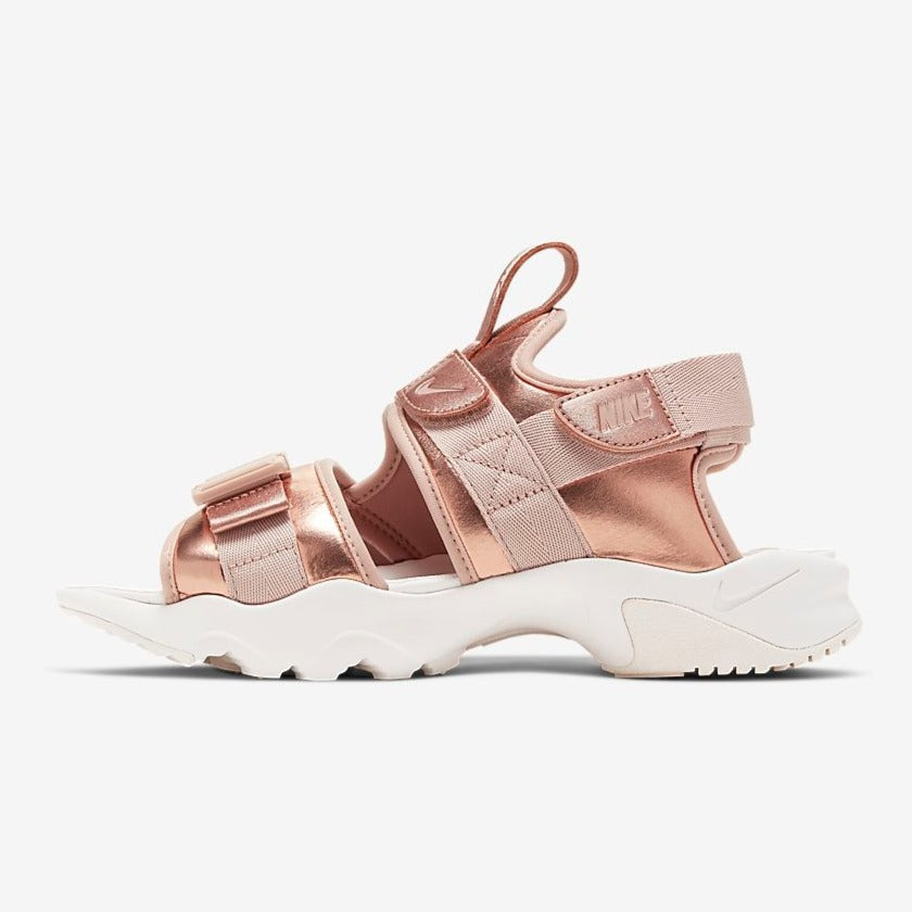 rose gold nike flip flops