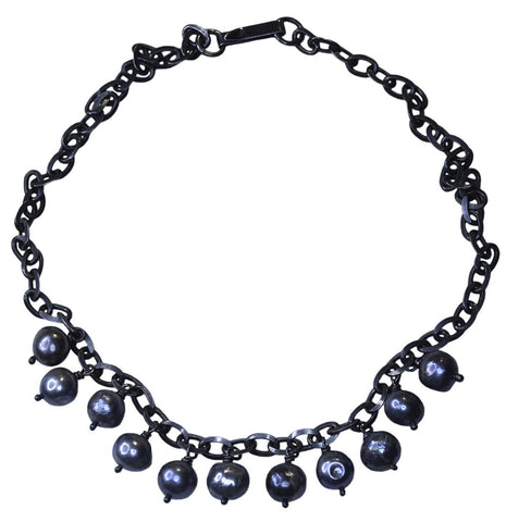 Thunderball necklace in oxidised silver with blue black pearls by Annika Burman