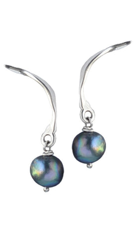 winged earrings in silver with black pearl, from The Twister Collection by Annika Burman