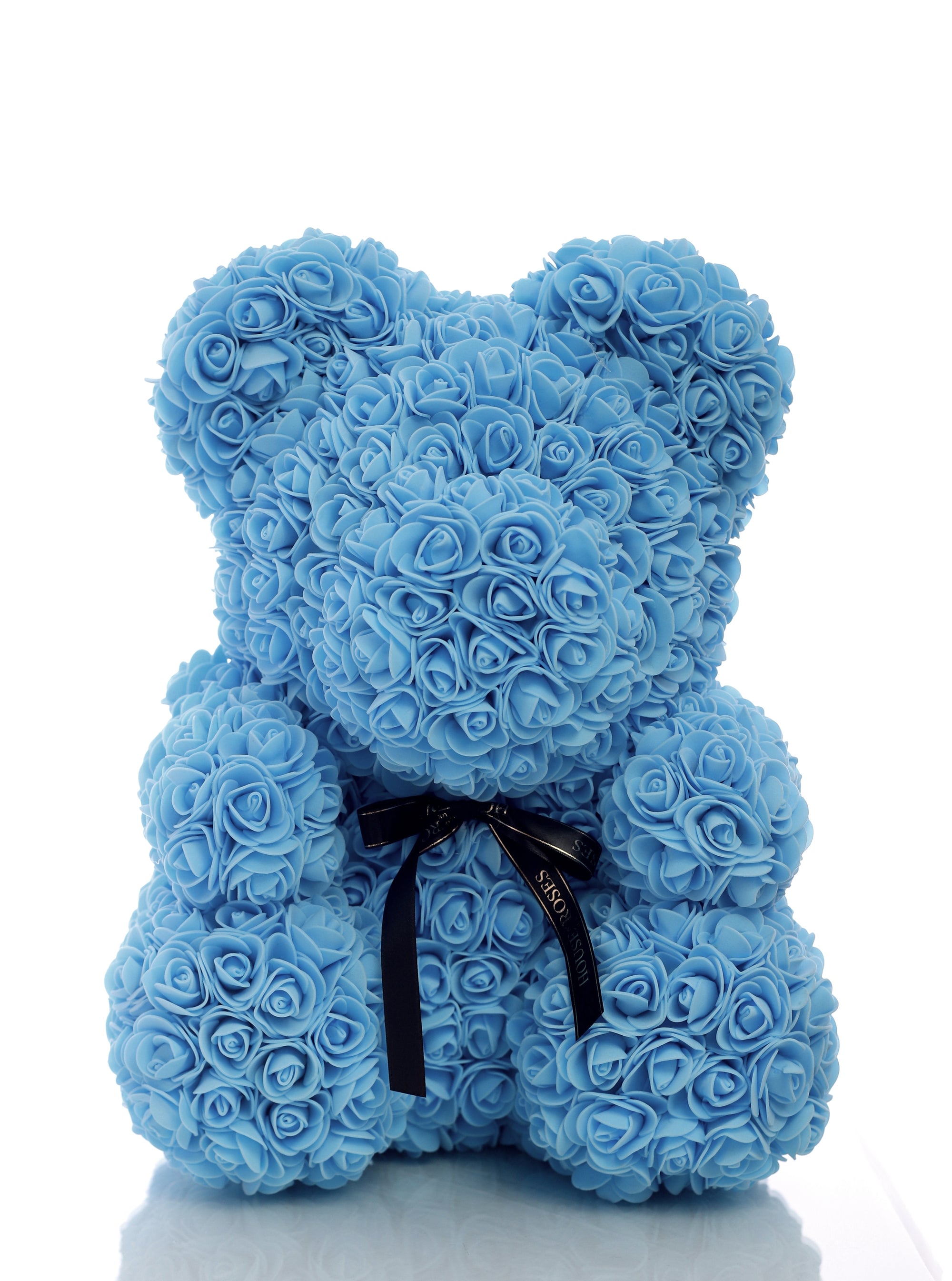 teddy bear with blue roses