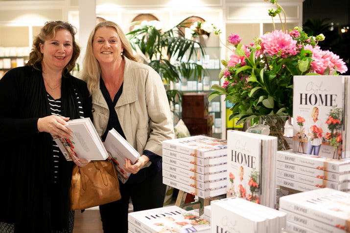 Fans hold Chyka's book.