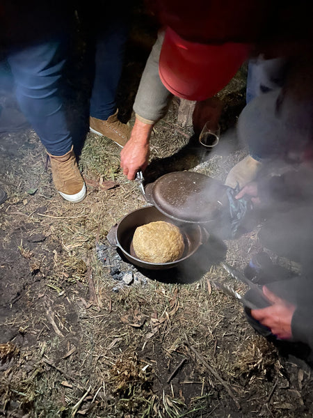 Kangaroo Grass Dutch Oven Damper cooking over a fire | Warndu Australian Native Food