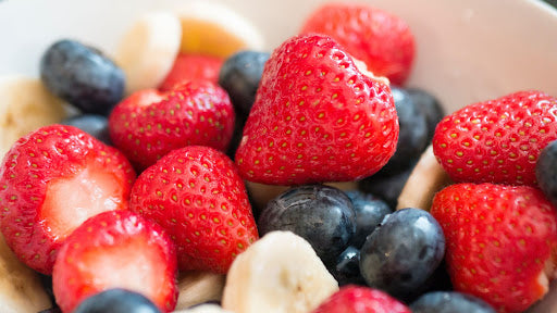 Strawberry and blueberry fruit salad with protein powder.
