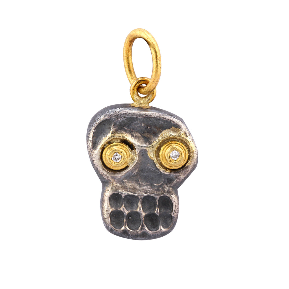 
            
                Load image into Gallery viewer, Front-facing view of Smiling Skull Charm by Prehistoric Works.
            
        