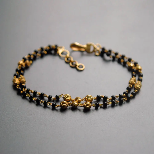 Golden chain bracelet with alphabet and cz charms 