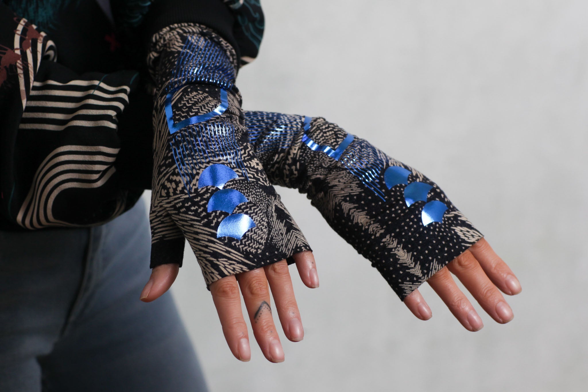 A woman's hands wearing Sophie Darling Hand Warmers