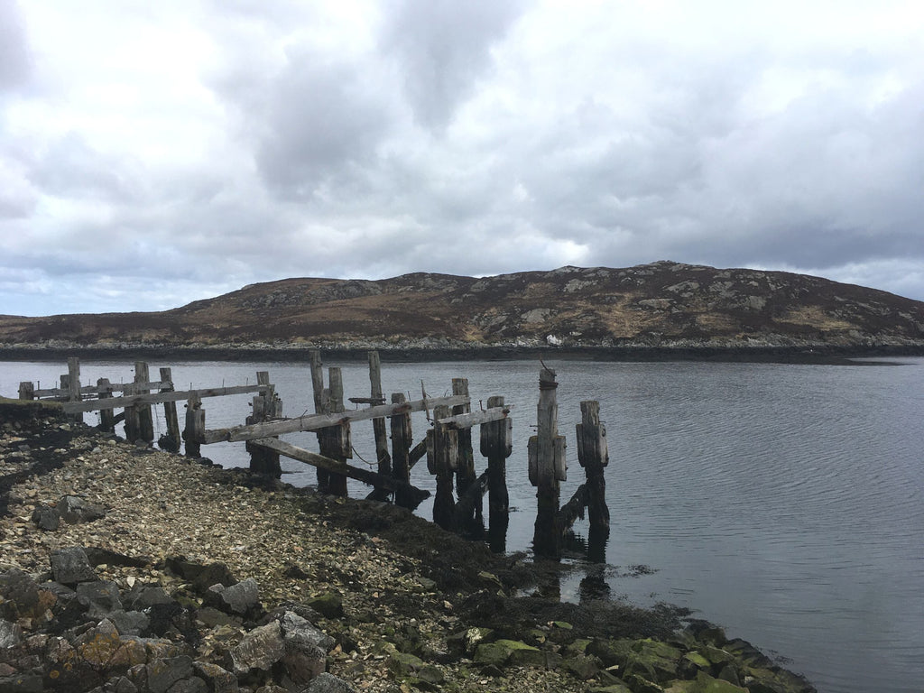 the eery remains of a broken down, wooden pier