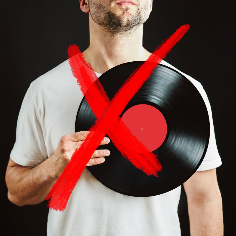 Man Holding Vinyl Record Incorrectly