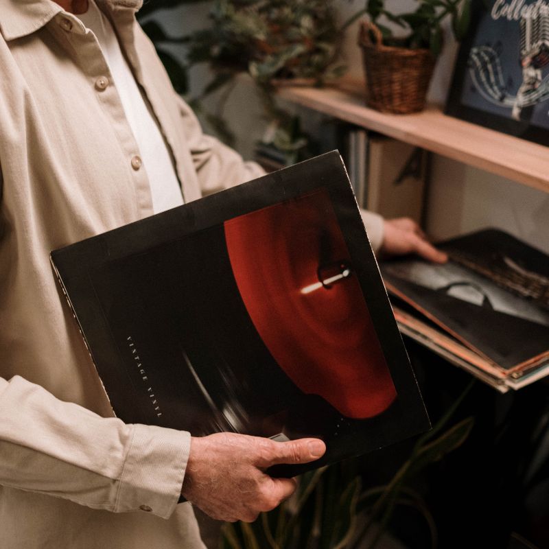 Man holding vinyl records