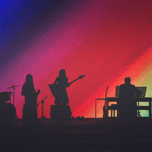 Band Playing Music Against Colourful Background