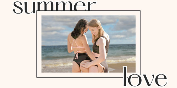 Two queer people in compression swimwear with text that says, "Summer Love"