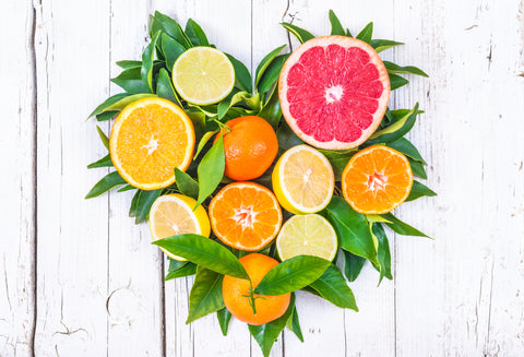 Citrus fruits heart vitamin C on white background