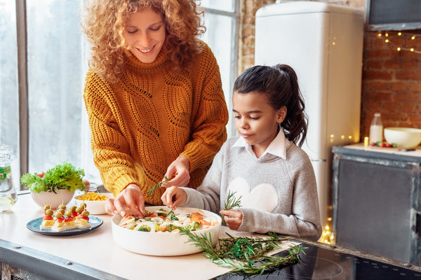 Happy curly woman and a girl niece making healthy vegan food - InterPlexus Blog