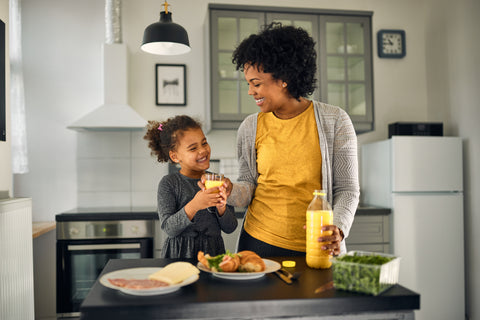 Smiling little girl, eating her favorite food - InterPlexus Blog