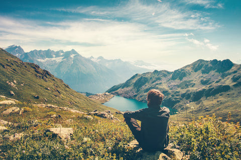Traveler Man relaxing Travel Lifestyle mountains and lake landscape - InterPlexus Blog