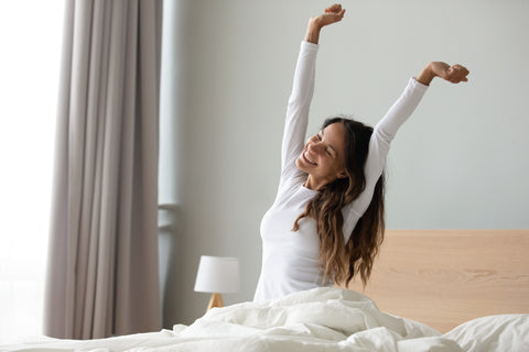 Young Healthy Woman Wakes Up with Tons of Energy After a Night of Blissful Deep Sleep
