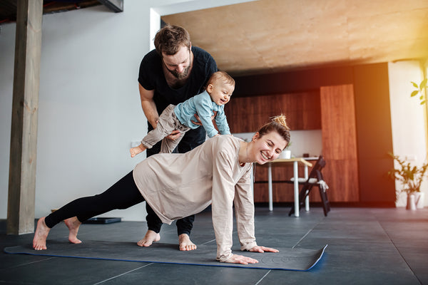 Family Doing Yoga at Home - Optimal Fertility